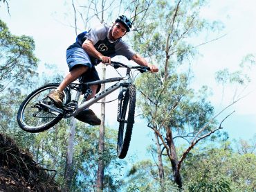 Person riding a mountain bike in the noosa hinterland